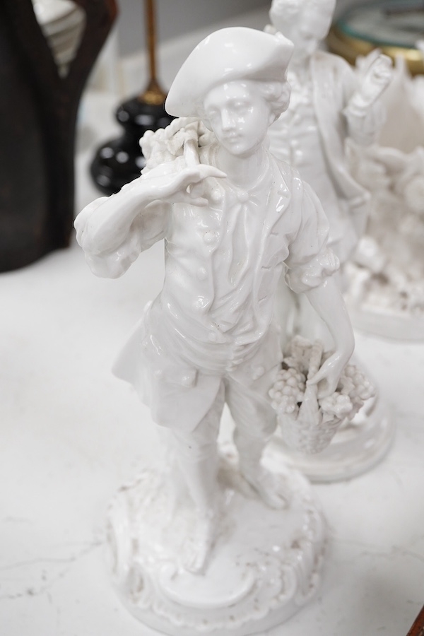 Three Continental white glazed figures and an English bone china group, tallest 25cm